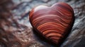 A macro shot of a wooden heart with visible wood grain patterns,