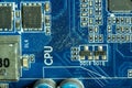 Macro shots of microcircuits and transistors on the dusty motherboard of a working personal computer