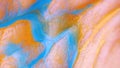 Macro skin, according to the folds of which flowing paint