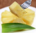 Macro of sliced pineapple with fork Royalty Free Stock Photo