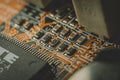 Macro snapshot of an old pcb computer. Letters and numbers.