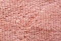 Macro of soft textile, Close up of short pile pink carpet woven, Fluffy fiber fabric cloth