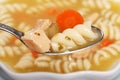 Macro spoonful of chicken pasta soup Royalty Free Stock Photo