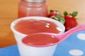 Macro spoonful of strawberry baby food