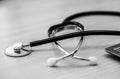 Macro stethoscope black and white on the table, close up. Horizontal image