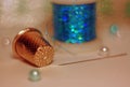 Macro still life with a thimble, coil, needle and thread.with blurred background and bokeh Royalty Free Stock Photo