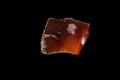 Macro stone Carnelian mineral on a black background