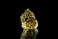 Macro stone mineral yellow beryl on a black background Royalty Free Stock Photo