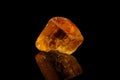 Macro stone mineral yellow topaz on a black background