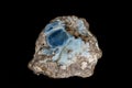 Macro stone Opal mineral in rock on a black background Royalty Free Stock Photo