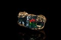 Macro stone Opal mineral in rock on a black background