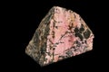 Macro stone Rhodonite mineral on a black background