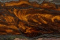 Macro stone tiger eye mineral in rock on black background Royalty Free Stock Photo