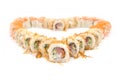 Macro of sushi rolls set isolated on on white background. Sushi served in food heart shape. Royalty Free Stock Photo