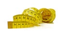 Macro of tangled yellow measure tape Royalty Free Stock Photo