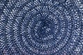 Macro texture of blue threads tied in a spiral between which there are white gaps. Close-up of knitted fabric Royalty Free Stock Photo
