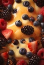 Macro texture of custard, decorated with raspberries, blackberries and blueberries. Top view Royalty Free Stock Photo