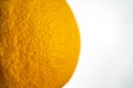 Macro of the texture skin orange grapefruit  on the white wall background. Close up Royalty Free Stock Photo