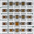 Grid of Surface Mount Ceramic Capacitors for Electronics Royalty Free Stock Photo