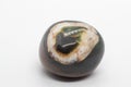 Macro tumbled dark green and brown sardonyx crystal, agate crystal