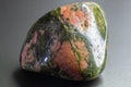 Macro tumbled green and orange Unakite Jasper chalcedony crystal