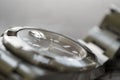 Macro, very shallow focus of part of a bezel on an iconic, swiss-made mechanical men`s diving watch.