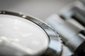 Macro, very shallow focus of part of a bezel on an iconic, swiss-made mechanical men`s diving watch. Royalty Free Stock Photo