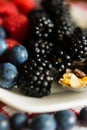 Macro view of blackberries, blueberries, raspberries and muesli