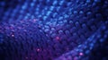 Macro View of Blue Woven Fabric with Red Glowing Particles and Light Reflections Keywords: macro Royalty Free Stock Photo