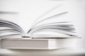 Wooden heart shape on a open book. Love reading concept close up.