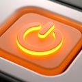 Close-up macro shot of an orange button with a glowing yellow flame symbol for power Royalty Free Stock Photo