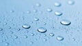 Macro view of clear water droplets on a light blue surface Royalty Free Stock Photo