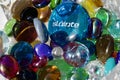 Macro view of a crystal glass bowl containing decorative glass stones