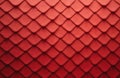 Macro view of interlocking red scales with subtle texture. The pattern shows gradient color from light to dark red. Abstract Royalty Free Stock Photo