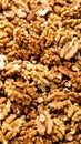 Macro view of a large pile of shelled walnuts creating a natural food texture and background Royalty Free Stock Photo
