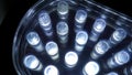 Macro view of lit LED lamps of a portable flashlight in perspective Royalty Free Stock Photo