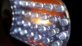 Macro view of lit LED lamps of a portable flashlight in perspective Royalty Free Stock Photo