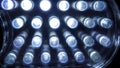 Macro view of lit LED lamps of a portable flashlight in perspective