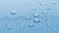 Macro view of numerous small and large water droplets on a smooth blue surface Royalty Free Stock Photo