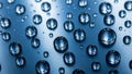 Macro view of numerous water droplets on a blue metallic surface Royalty Free Stock Photo