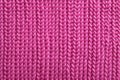 macro view of a pink knit sweater material