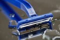 Macro view of safety razor blade on water drops background