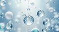 Macro view of translucent water droplets suspended in a soft blue and white background Royalty Free Stock Photo