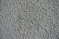 Macro of wall with gray roughcast finish