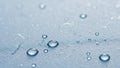 Macro water droplets on a textured light blue surface Royalty Free Stock Photo