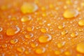 Macro water drops refracting light on orange surface Royalty Free Stock Photo