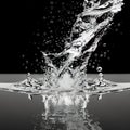 macro water splash on black background Royalty Free Stock Photo
