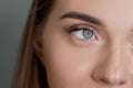 Macro of woman blue eye with false eyelashes. Vision correction Royalty Free Stock Photo