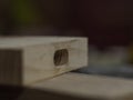 Macro. wooden blank for a mallet. wooden board with a hole