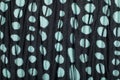 Macro of wrinkly dotted black and turquoise cloth for background Royalty Free Stock Photo